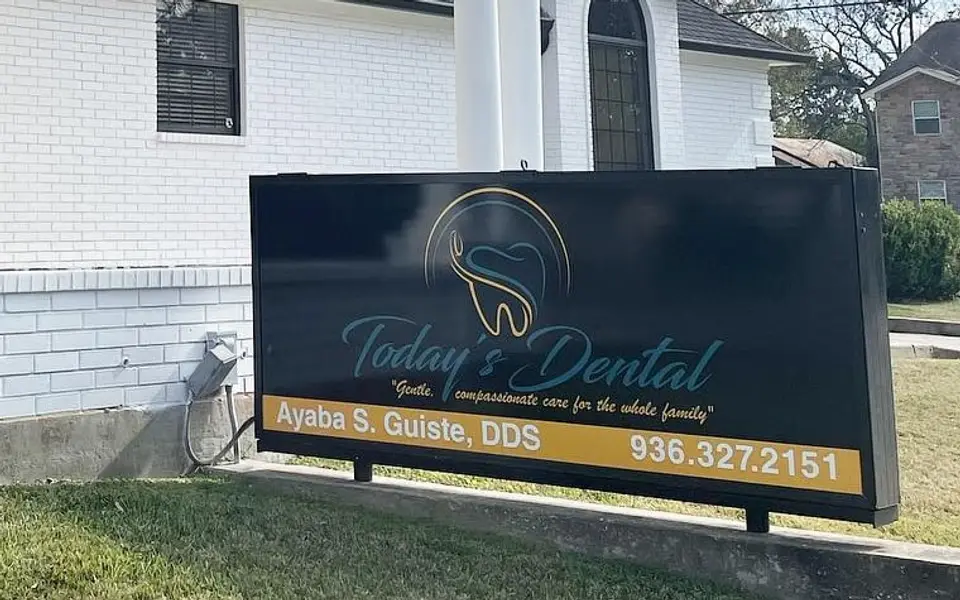 The Today's Dental sign out front, with Ayaba S. Guiste, DDS and the office phone number
